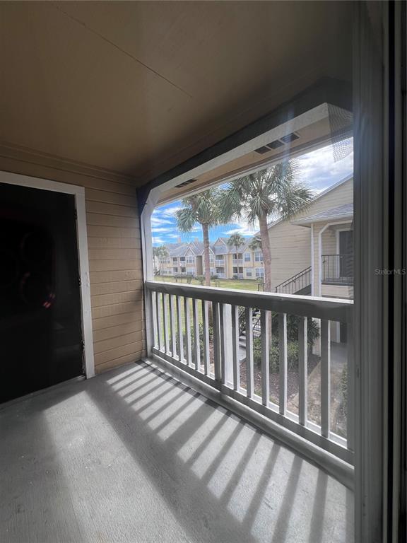 1061 South Hiawassee Road, Unit 1724 Orlando, FL 32835 - Photo 10 of 10 a view of a glass door with a balcony