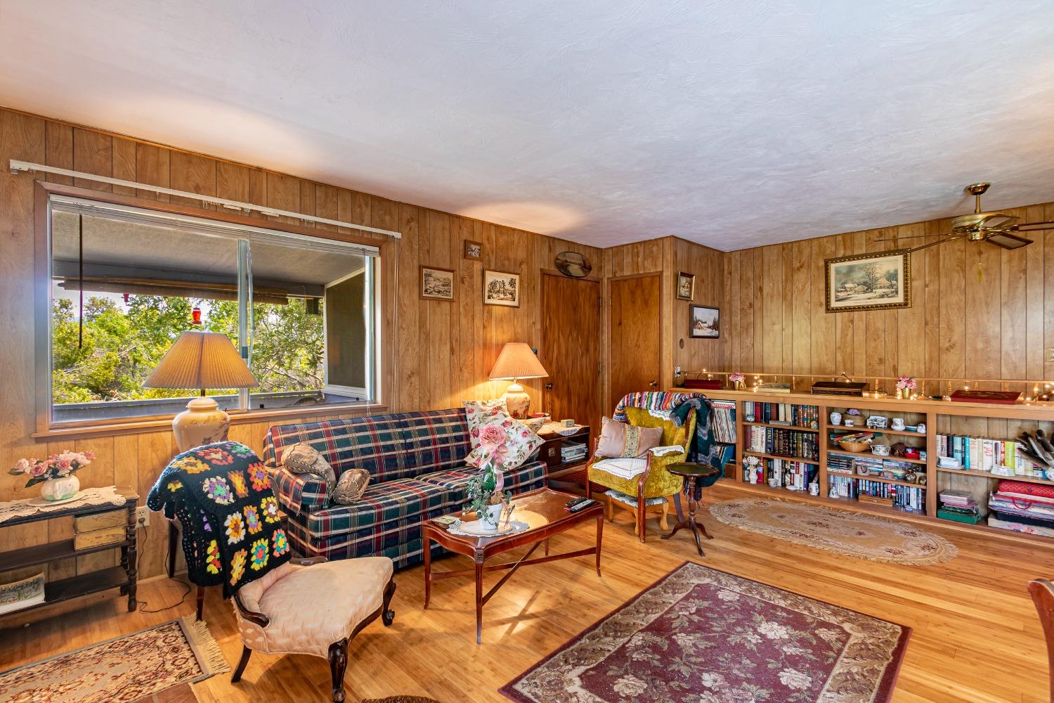 5090 Tiptop Road Mariposa, CA 95338 - Photo 13 of 46 a living room filled with furniture and a large window