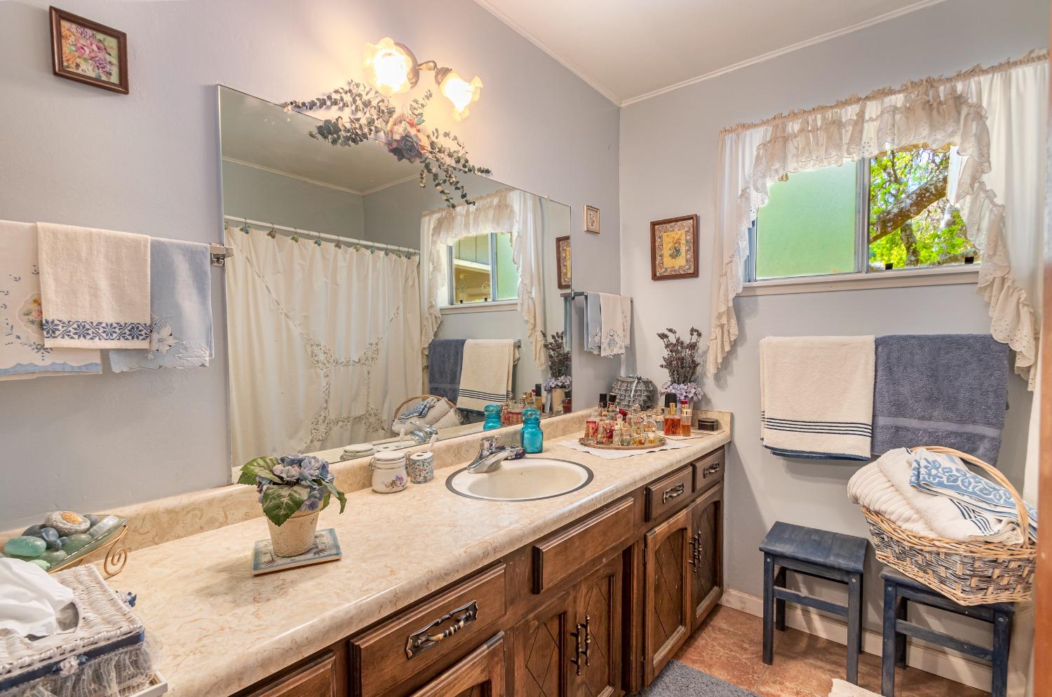 5090 Tiptop Road Mariposa, CA 95338 - Photo 14 of 46 a kitchen with a sink stove and a refrigerator