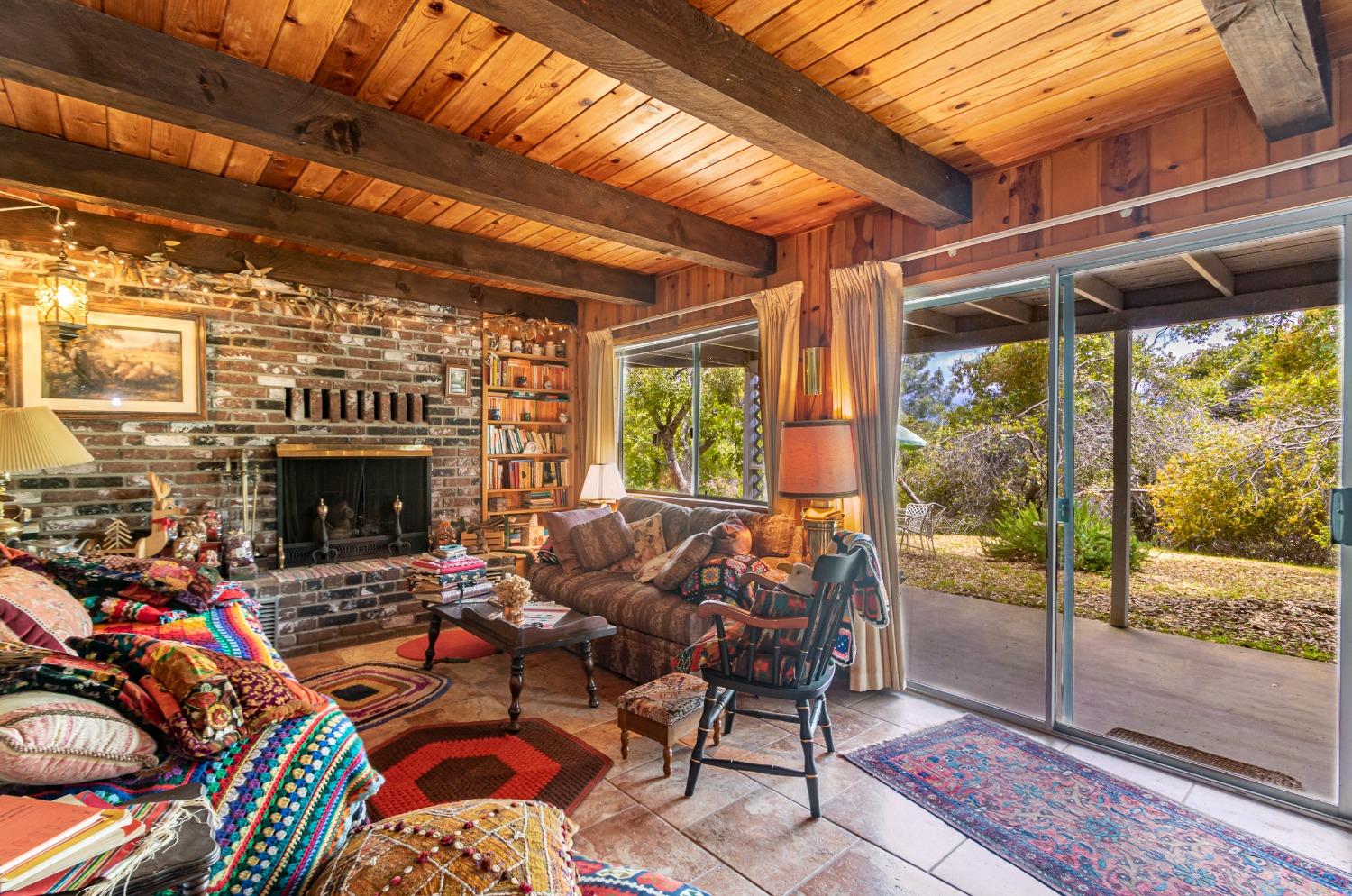 5090 Tiptop Road Mariposa, CA 95338 - Photo 18 of 46 a outdoor living space with patio furniture and a fireplace