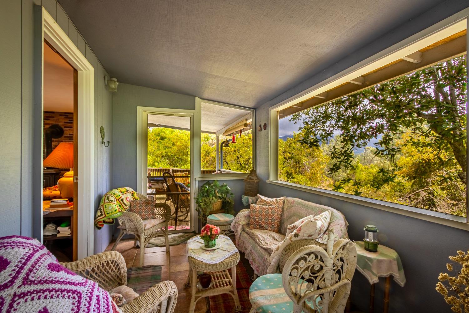 5090 Tiptop Road Mariposa, CA 95338 - Photo 26 of 46 a living room with furniture and a large window