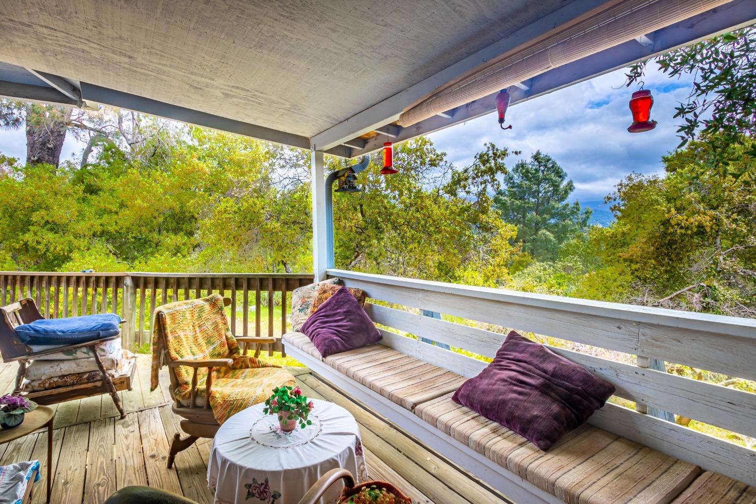 5090 Tiptop Road Mariposa, CA 95338 - Photo 27 of 46 a view of a chairs and table in the balcony