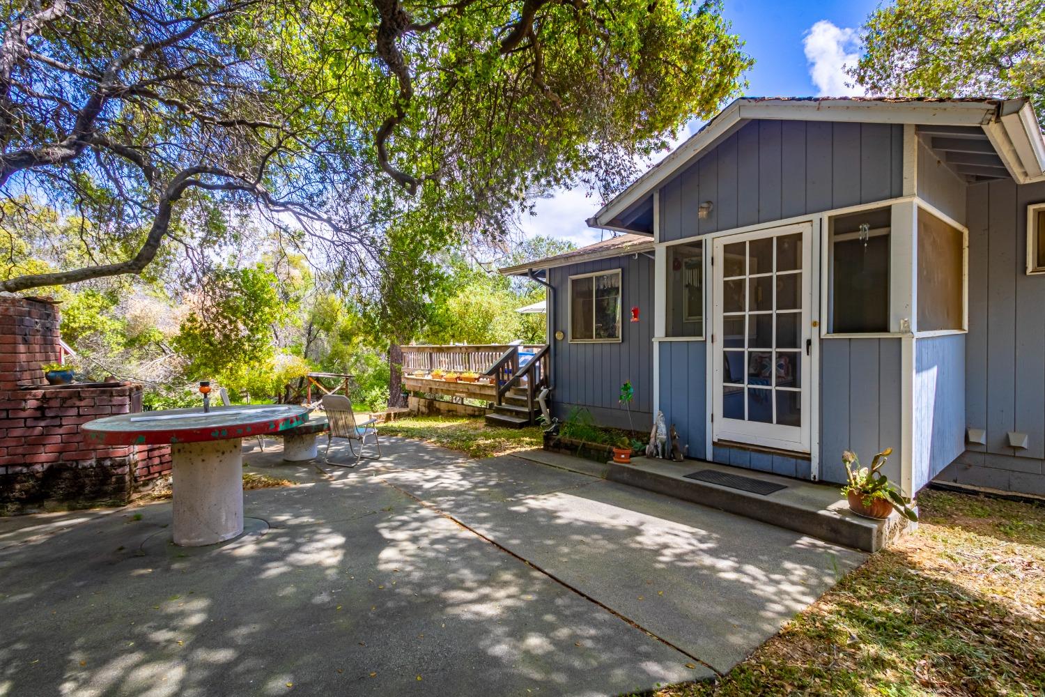5090 Tiptop Road Mariposa, CA 95338 - Photo 34 of 46 a view of a house with backyard and sitting area