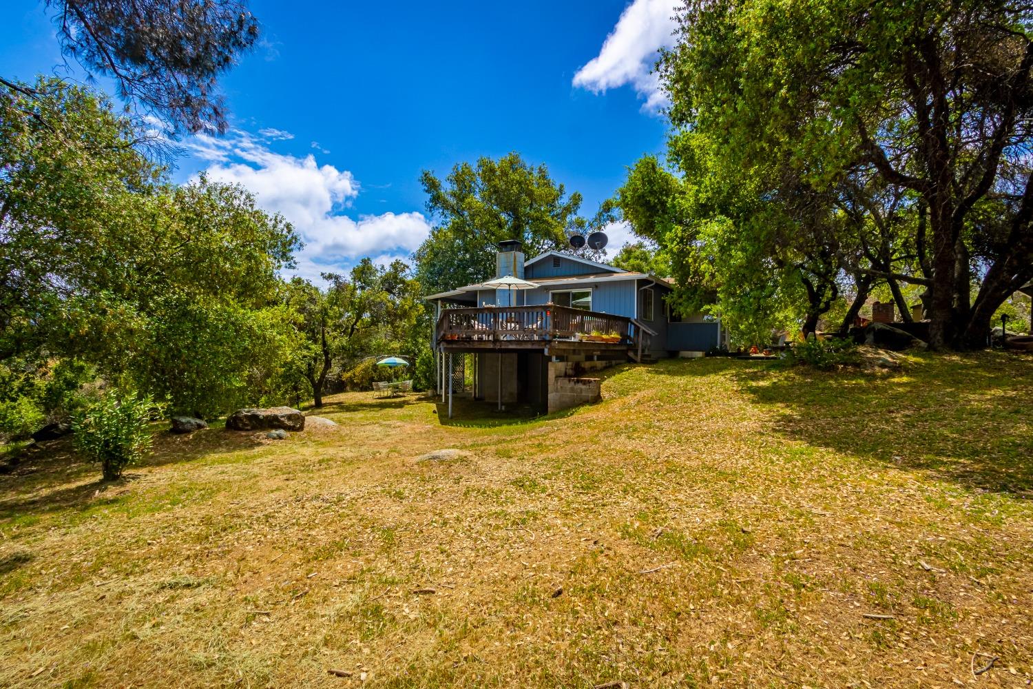 5090 Tiptop Road Mariposa, CA 95338 - Photo 36 of 46 a view of a house with a yard