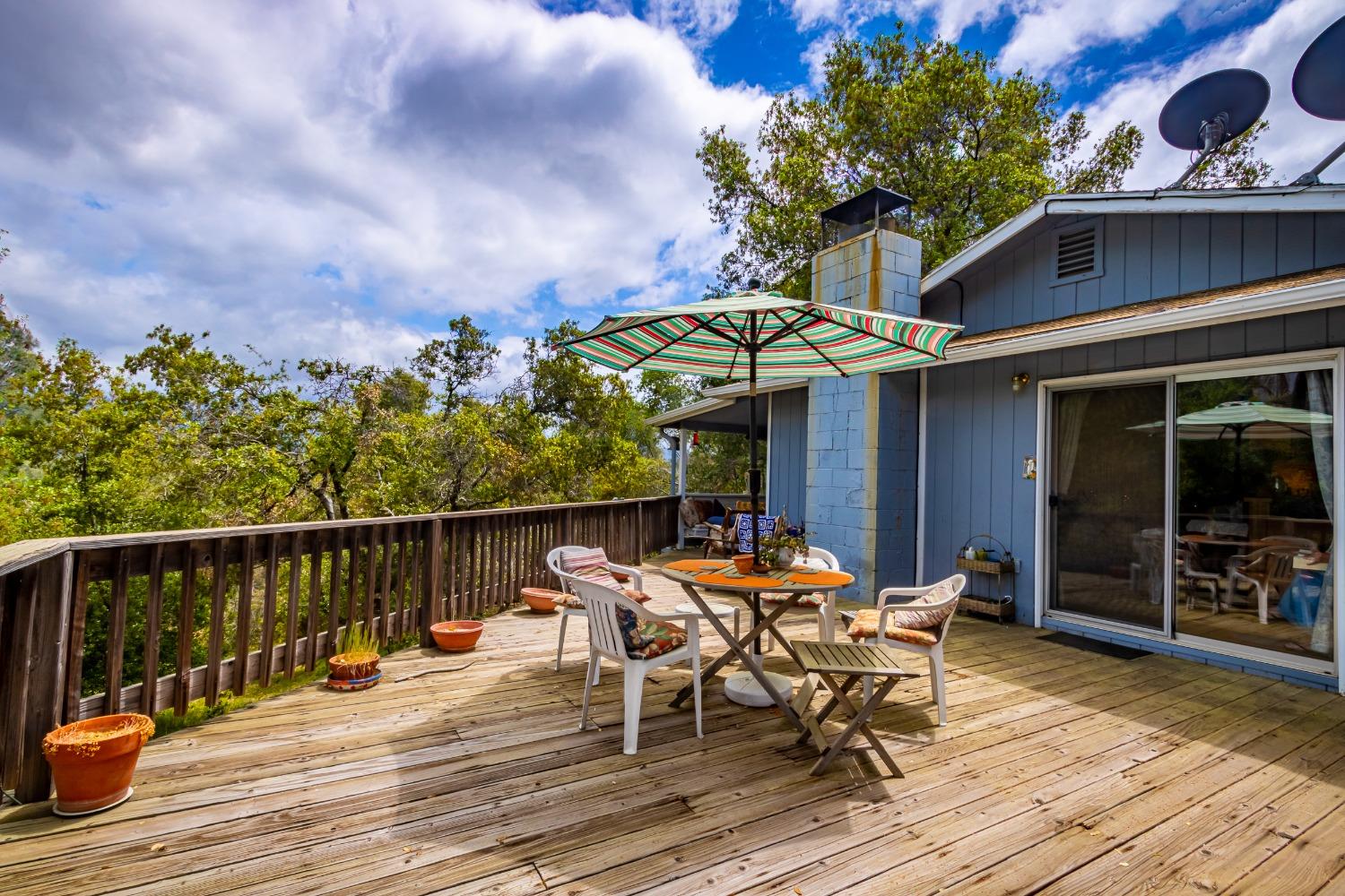 5090 Tiptop Road Mariposa, CA 95338 - Photo 38 of 46 an outdoor space with furniture and umbrella