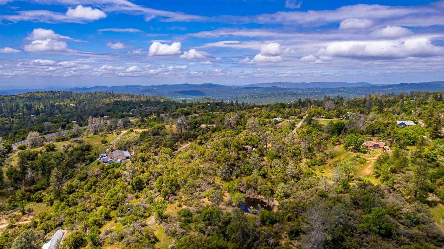 5090 Tiptop Road Mariposa, CA 95338 - Photo 42 of 46 a view of a large yard with a street