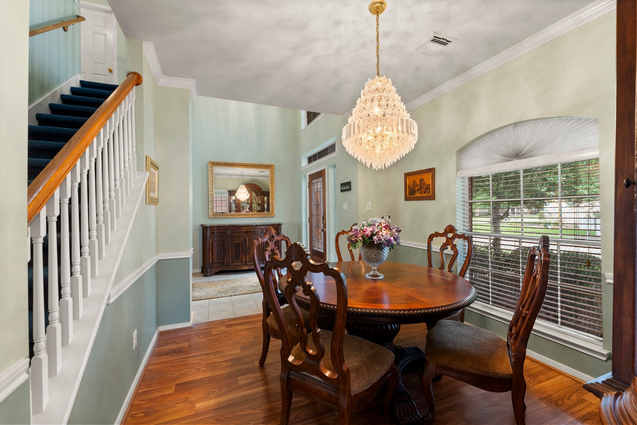 4210 Rainfall Drive Pasadena, TX 77505 - Photo 13 of 46 a view of a dining room with furniture window and wooden floor