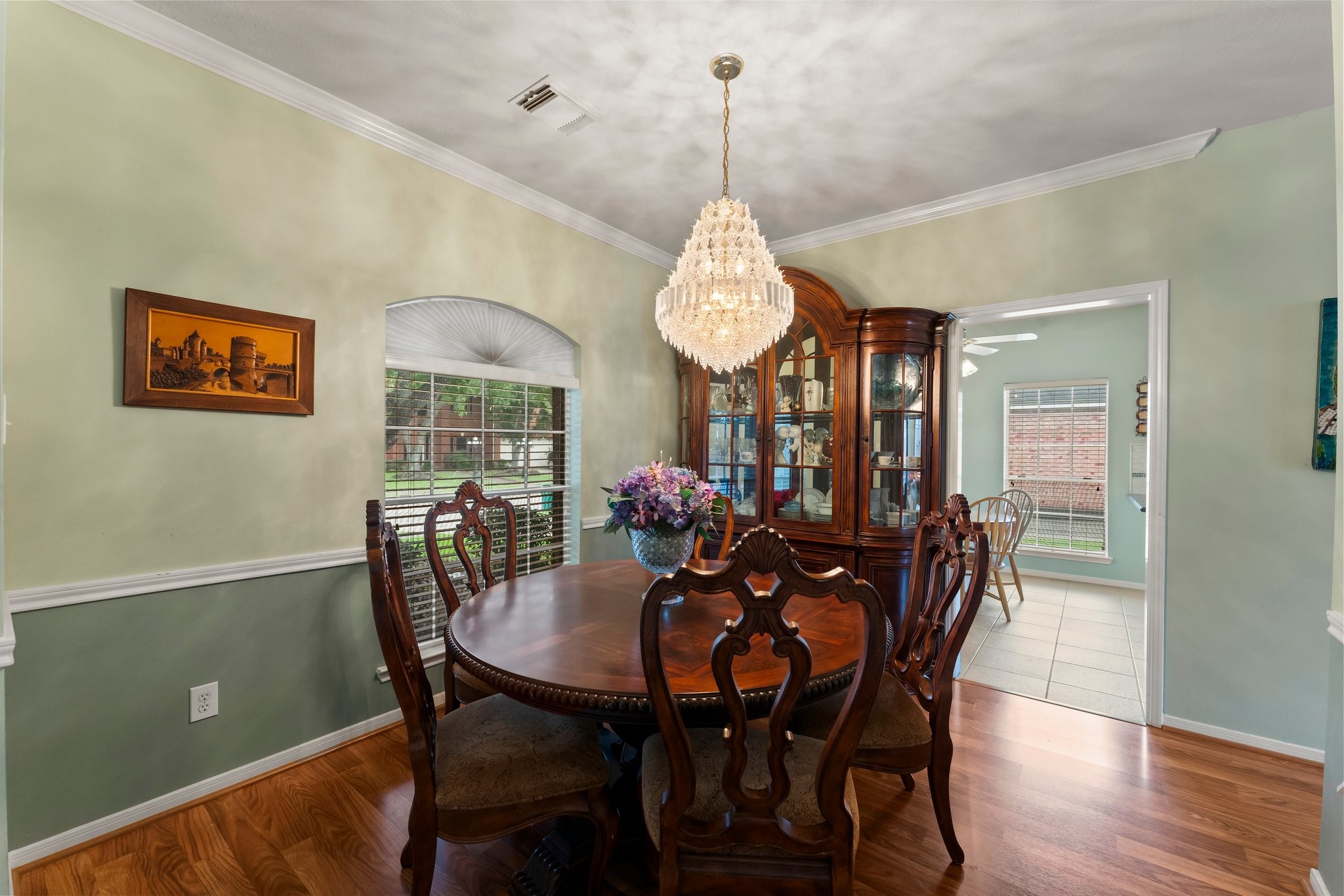 4210 Rainfall Drive Pasadena, TX 77505 - Photo 14 of 46 a view of a dining room with furniture window and wooden floor