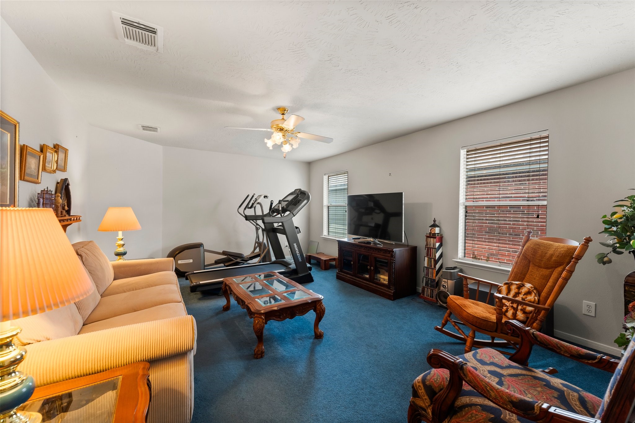 4210 Rainfall Drive Pasadena, TX 77505 - Photo 16 of 46 a living room with furniture a flat screen tv and a window