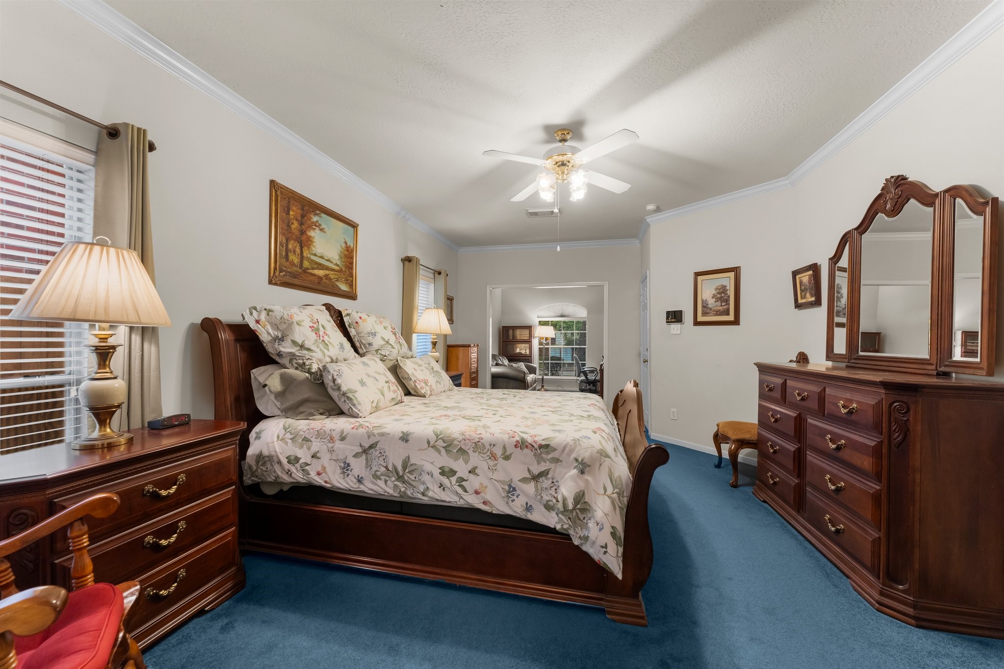 4210 Rainfall Drive Pasadena, TX 77505 - Photo 26 of 46 a bedroom with a bed and a chandelier