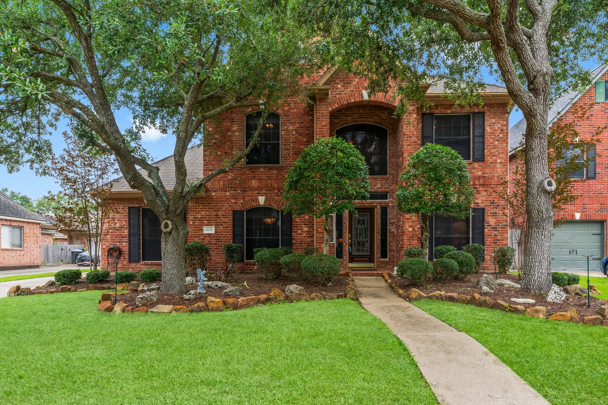 4210 Rainfall Drive Pasadena, TX 77505 - Photo 39 of 46 a front view of house with yard and green space