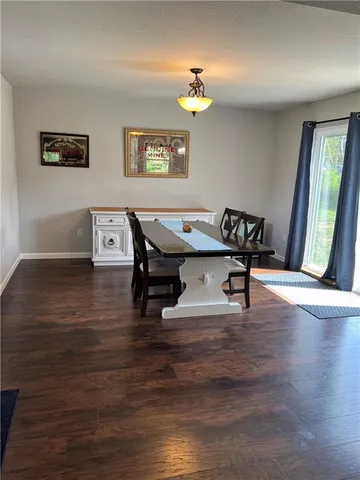 a view of a dining room with furniture and a table