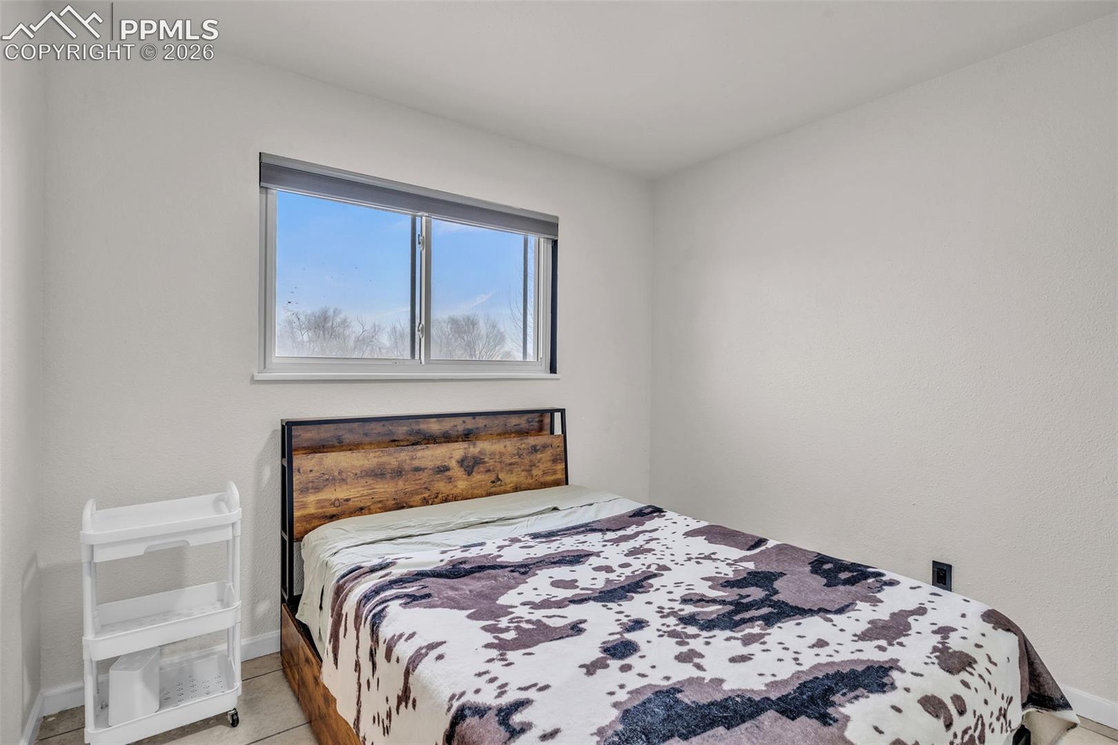 1498 Peterson Road Colorado Springs, CO 80915 - Photo 22 of 44 Bedroom with baseboards