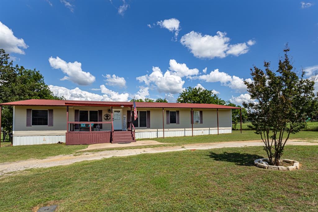 75 Southern Road Mineral Wells, TX 76067 - Photo 2 of 31 a view of a house with backyard and sitting area