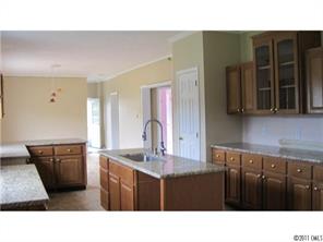 2060 Brer Rabbit Run Rock Hill, SC 29730 - Photo 2 of 16 a kitchen with granite countertop a sink cabinets and stainless steel appliances