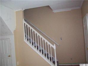 2060 Brer Rabbit Run Rock Hill, SC 29730 - Photo 5 of 16 a view of staircase with railing and white walls