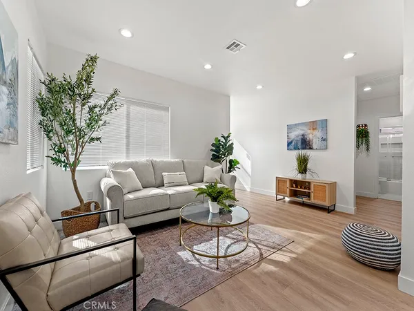 a bedroom with a bed and table