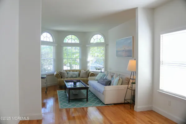 a living room with furniture and windows