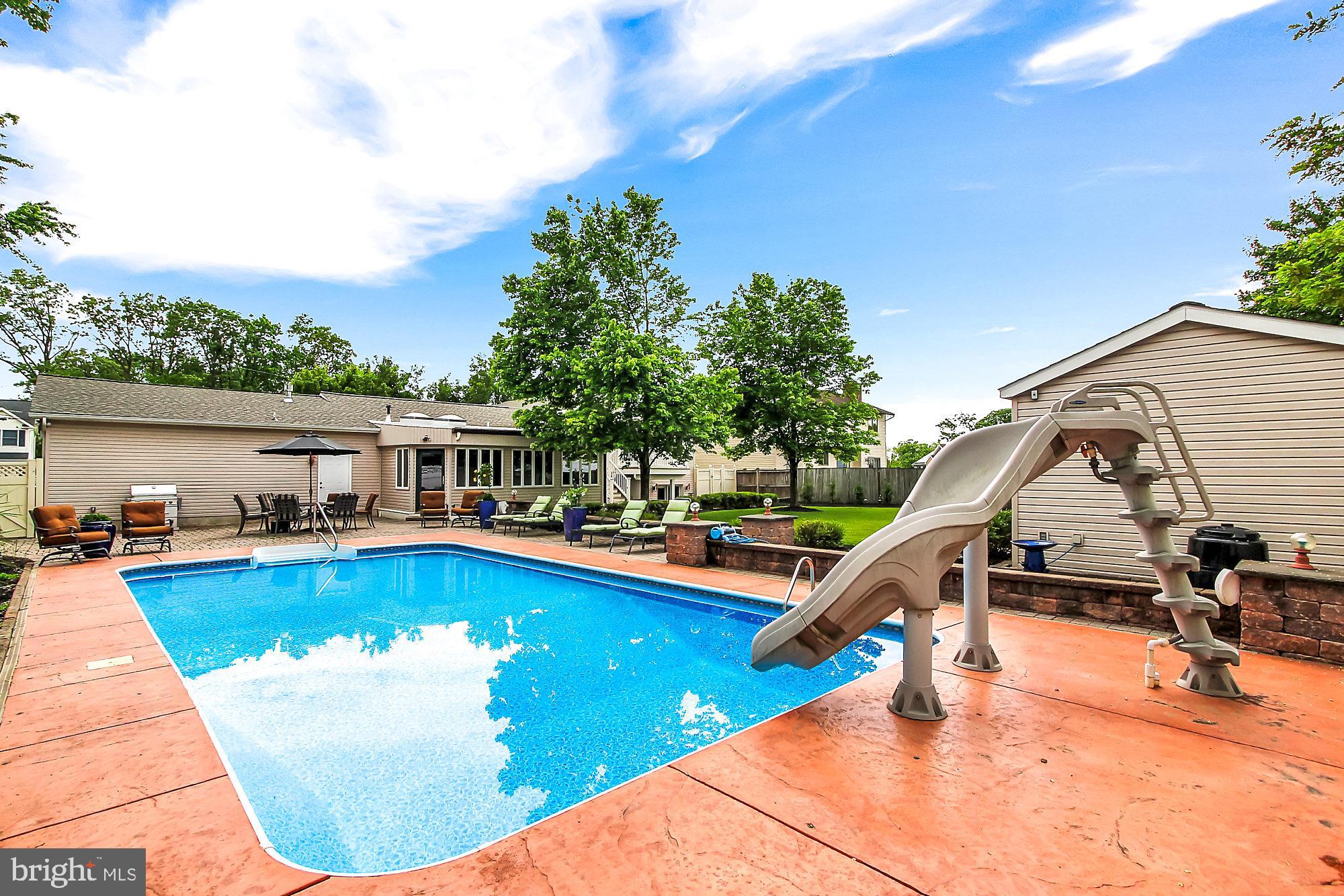 8642 Winding Way Perry Hall, MD 21128 - Photo 43 of 45 Pool area - note stone retaining wall w/seating