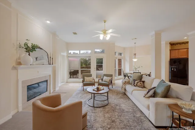 a living room with furniture fireplace and window