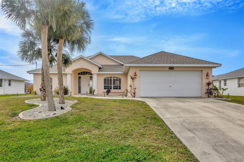 181 Marker Road Rotonda West, FL 33947 - Photo 1 of 1 a front view of a house with a yard