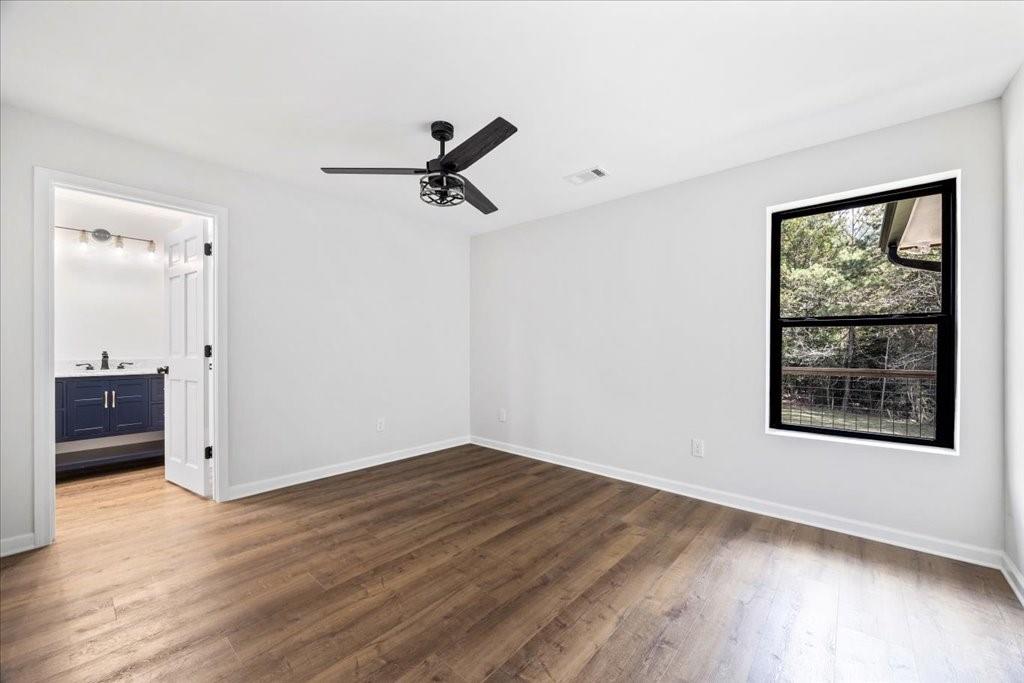 2400 Nebo Road Douglasville, GA 30134 - Photo 11 of 62 an empty room with wooden floor and windows