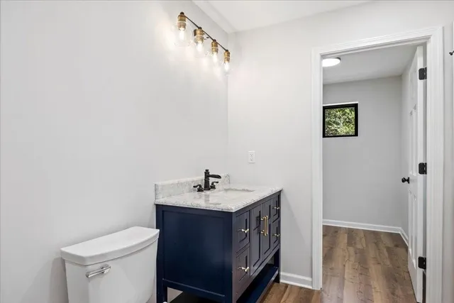 a bathroom with a double vanity sink and mirror