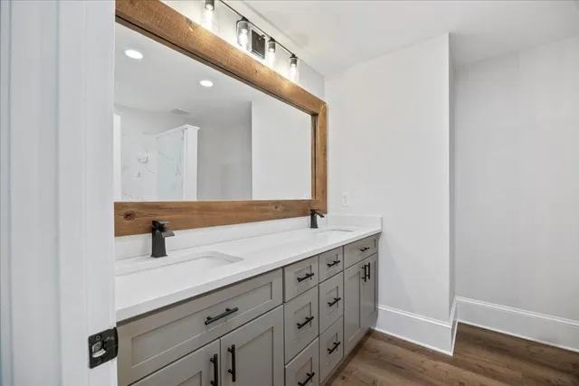 a view of an empty room and wooden floor