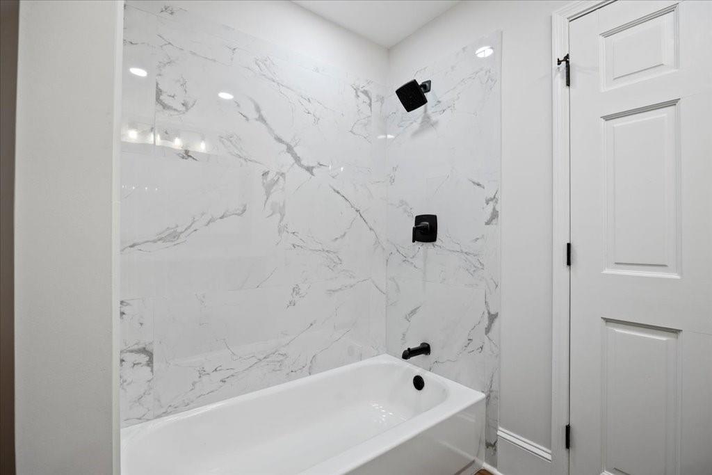 2400 Nebo Road Douglasville, GA 30134 - Photo 17 of 62 a bathroom with a bathtub and shower