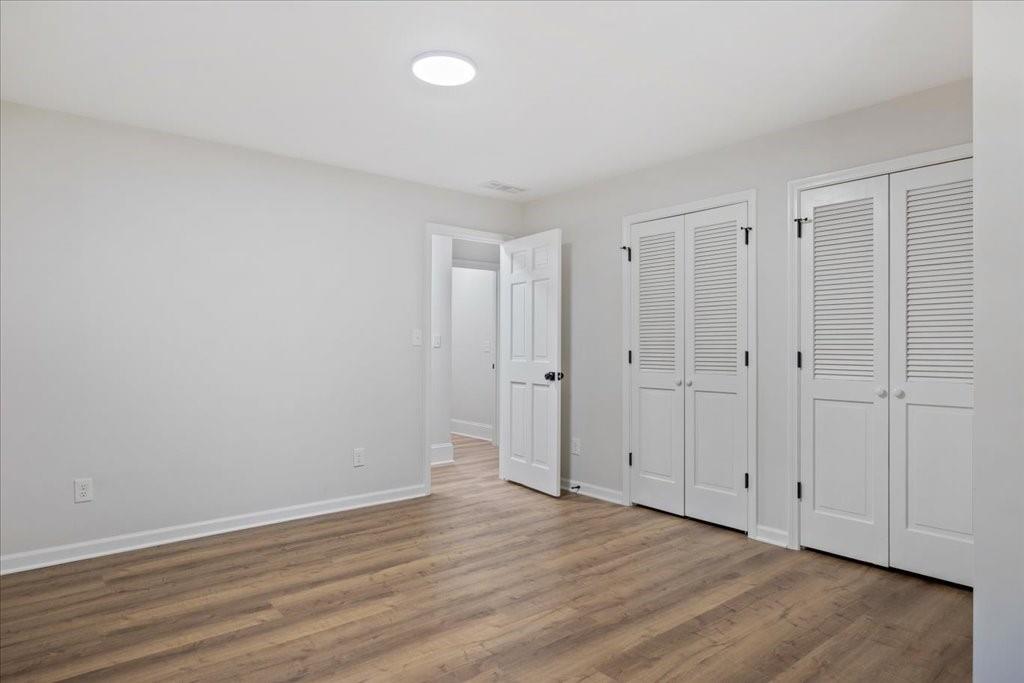 2400 Nebo Road Douglasville, GA 30134 - Photo 19 of 62 a view of an empty room and wooden floor