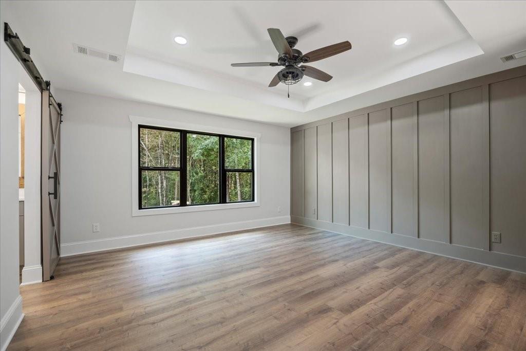 2400 Nebo Road Douglasville, GA 30134 - Photo 22 of 62 a view of an empty room with wooden floor and a window
