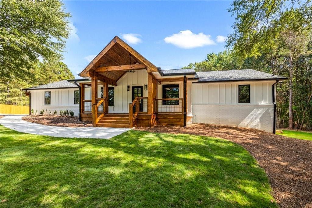2400 Nebo Road Douglasville, GA 30134 - Photo 3 of 62 a front view of house with yard and green space