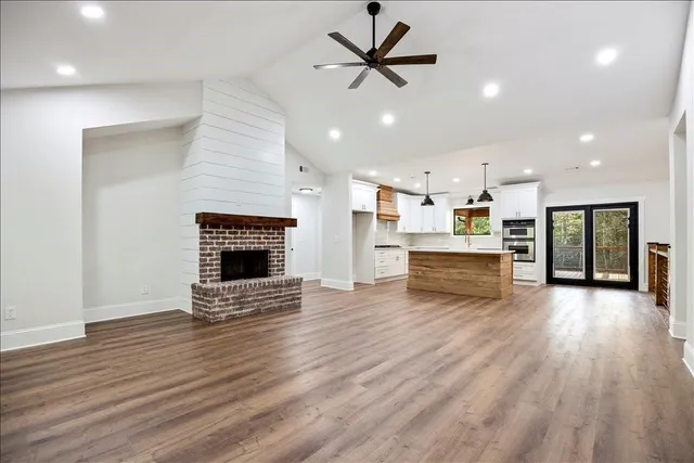 a view of kitchen with cabinets and wooden floor