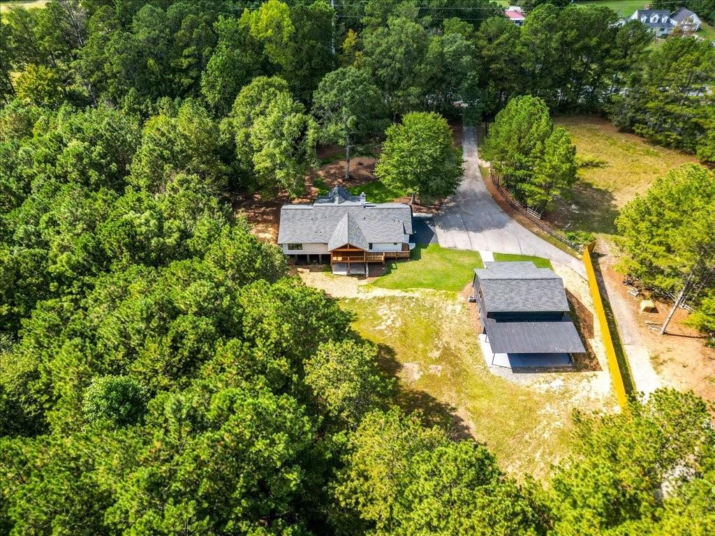 2400 Nebo Road Douglasville, GA 30134 - Photo 52 of 62 an aerial view of a house with swimming pool and large trees
