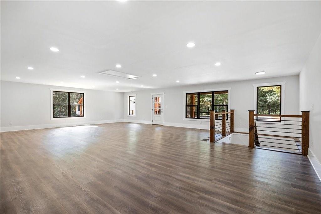 2400 Nebo Road Douglasville, GA 30134 - Photo 56 of 62 a view of an empty room with wooden floor and windows