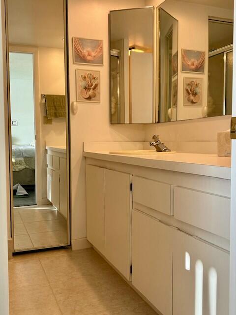 6166 Southeast Riverboat Drive, Unit 926 Stuart, FL 34997 - Photo 13 of 30 a bathroom with a sink and a mirror