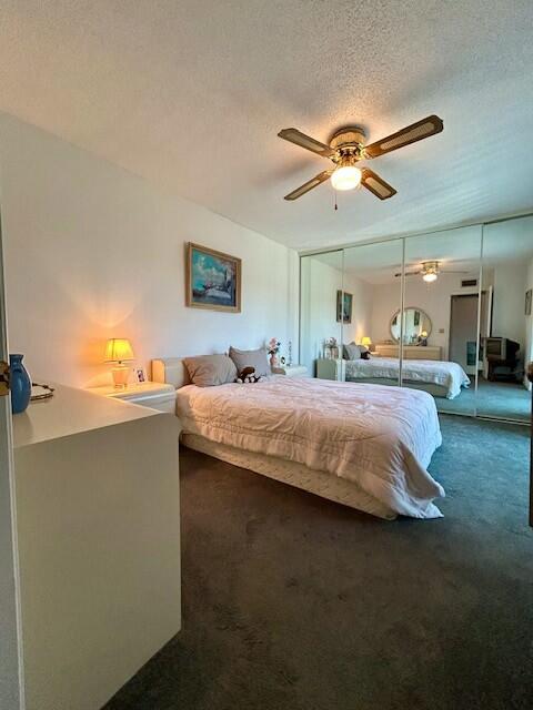 6166 Southeast Riverboat Drive, Unit 926 Stuart, FL 34997 - Photo 18 of 30 a bedroom with a bed and ceiling fan