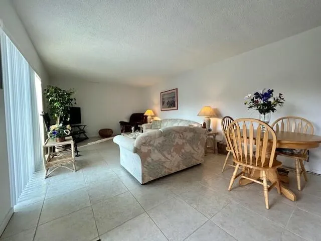 a bedroom with furniture and a chair