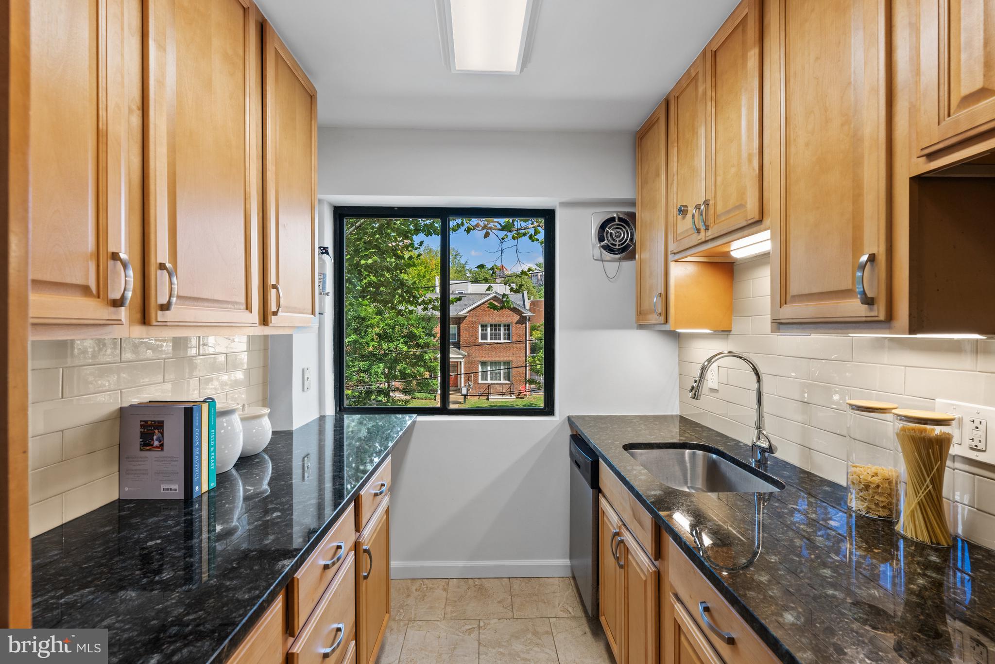 3901 Tunlaw Road Northwest, Unit 606 Washington, DC 20007 - Photo 12 of 37 Kitchen Overlooking Fulton Street