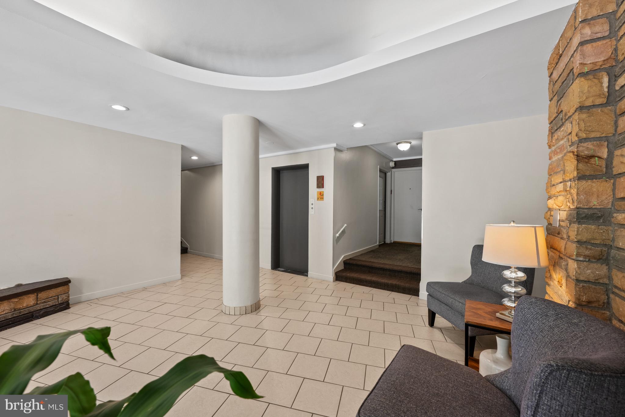 3901 Tunlaw Road Northwest, Unit 606 Washington, DC 20007 - Photo 32 of 37 Lobby with Elevator