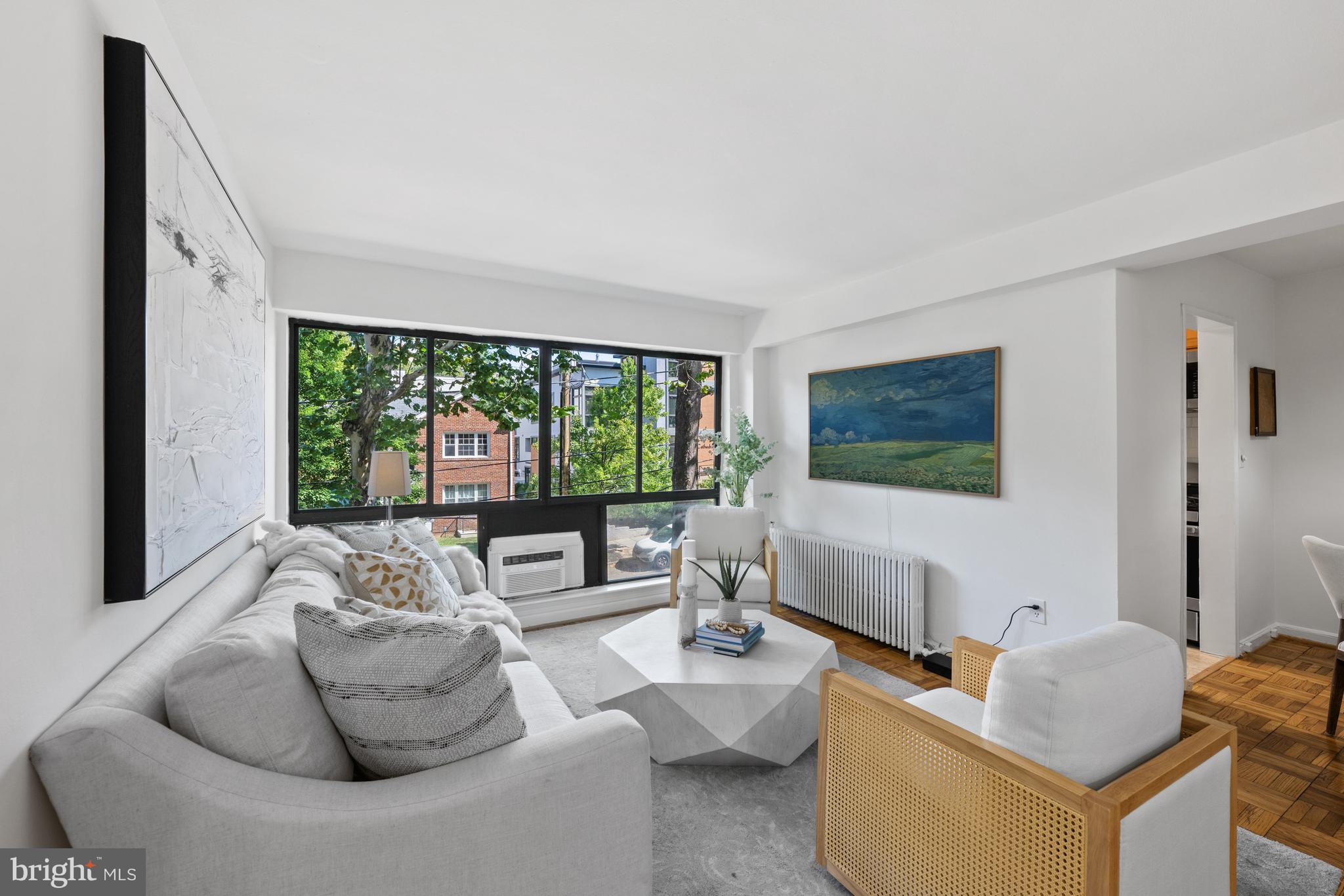 3901 Tunlaw Road Northwest, Unit 606 Washington, DC 20007 - Photo 5 of 37 Living Room Overlooking Fulton Street