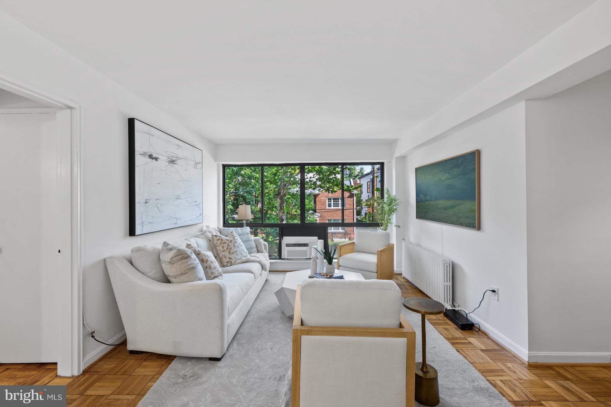 3901 Tunlaw Road Northwest, Unit 606 Washington, DC 20007 - Photo 6 of 37 Living Room with Wall of Windows
