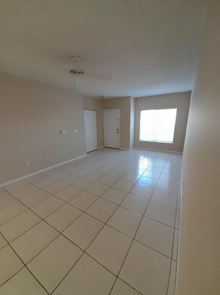 10336 Fox Trail Road South, Unit 1306 Royal Palm Beach, FL 33411 - Photo 10 of 10 a view of an empty room and window