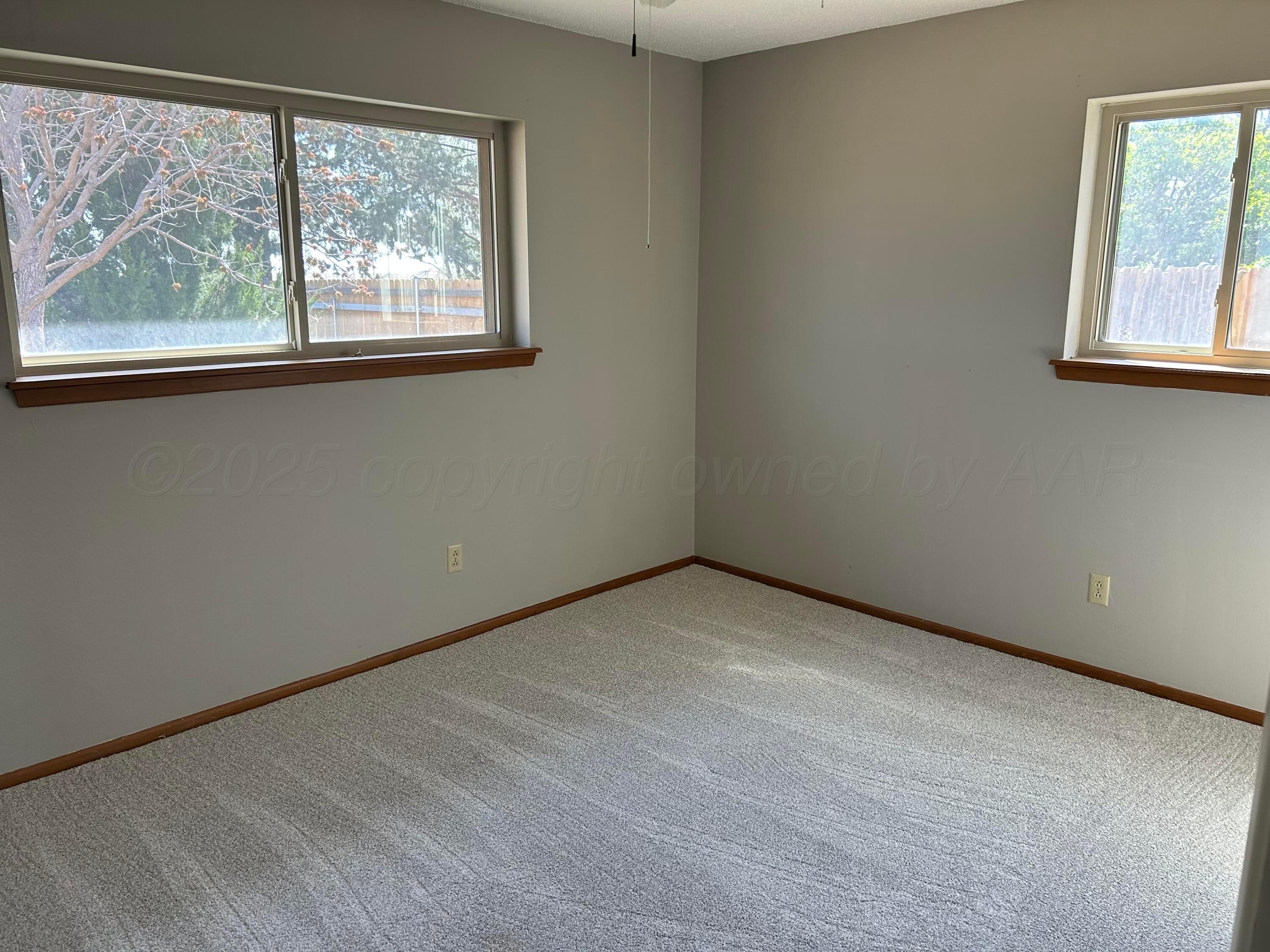 613 South Fulton Street Stratford, TX 79084 - Photo 8 of 15 a view of an empty room with a window