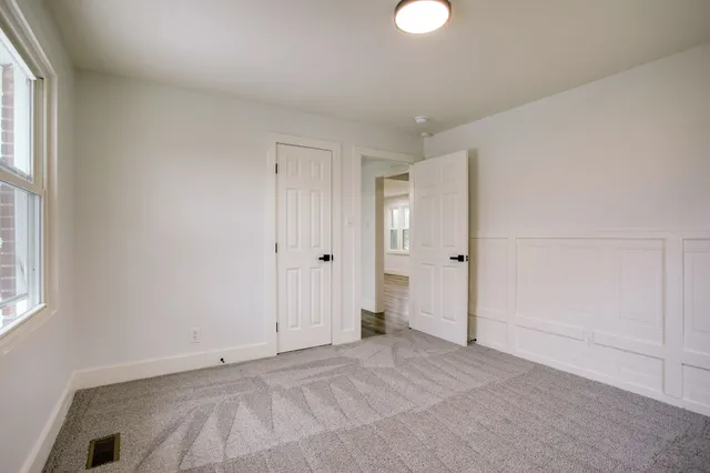 a view of an empty room and window