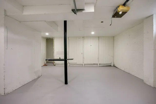 an empty room with a ceiling fan