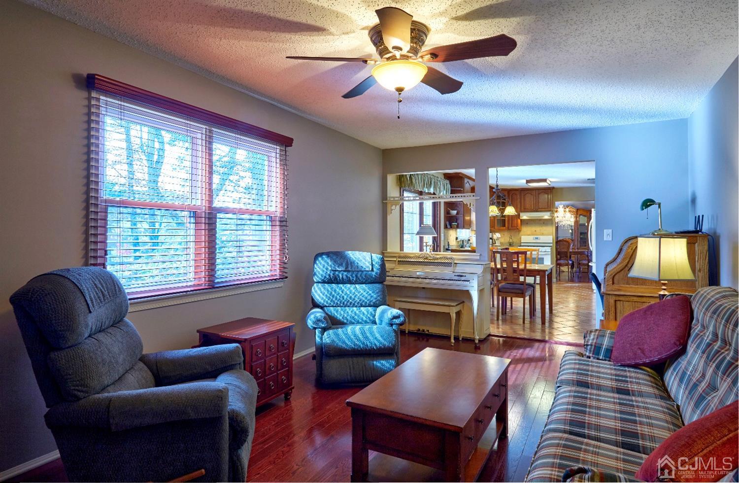 21 Aqueduct Place Howell, NJ 07731 - Photo 14 of 44 a living room with furniture and a chandelier