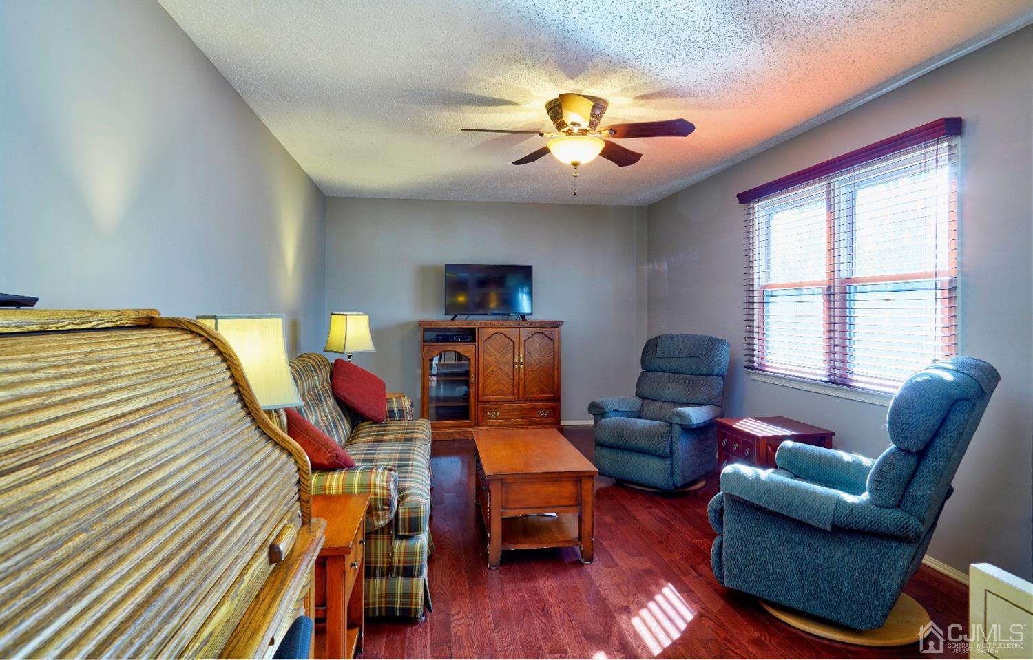 21 Aqueduct Place Howell, NJ 07731 - Photo 15 of 44 a living room with furniture and wooden floor