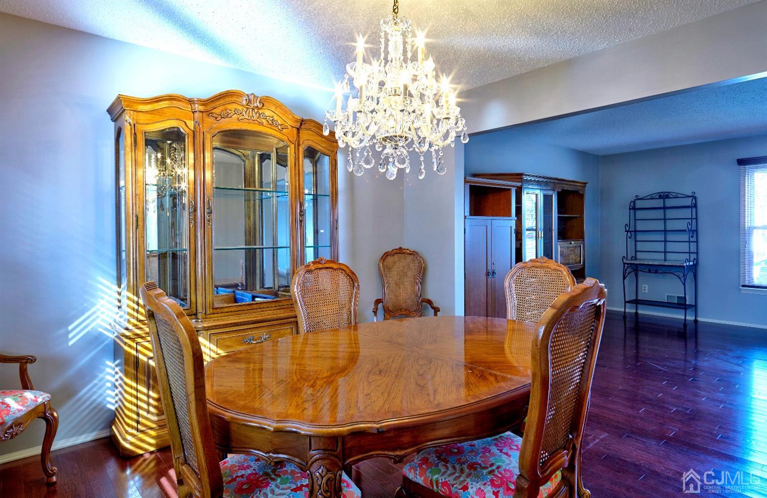 21 Aqueduct Place Howell, NJ 07731 - Photo 17 of 44 a dining room with furniture and wooden floor