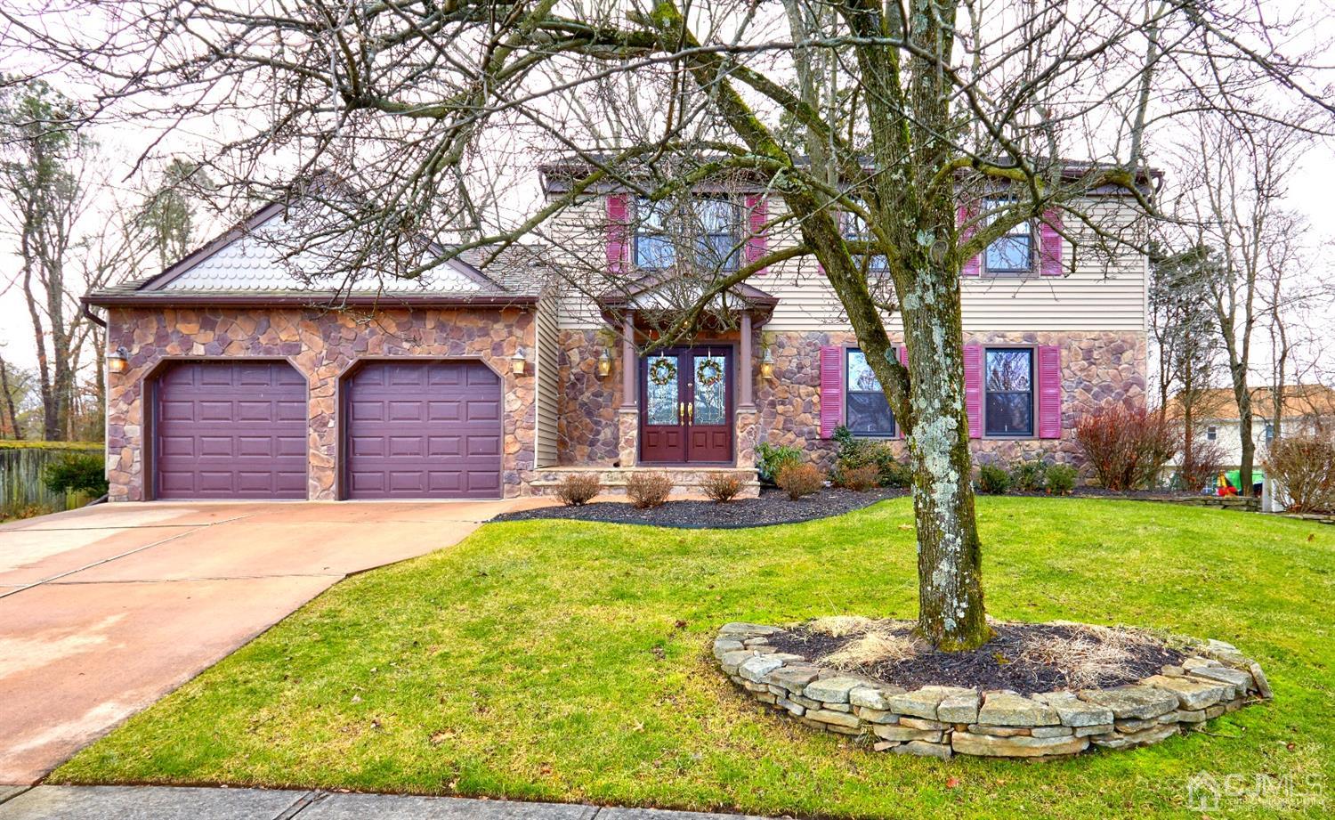 21 Aqueduct Place Howell, NJ 07731 - Photo 2 of 44 a front view of a house with yard